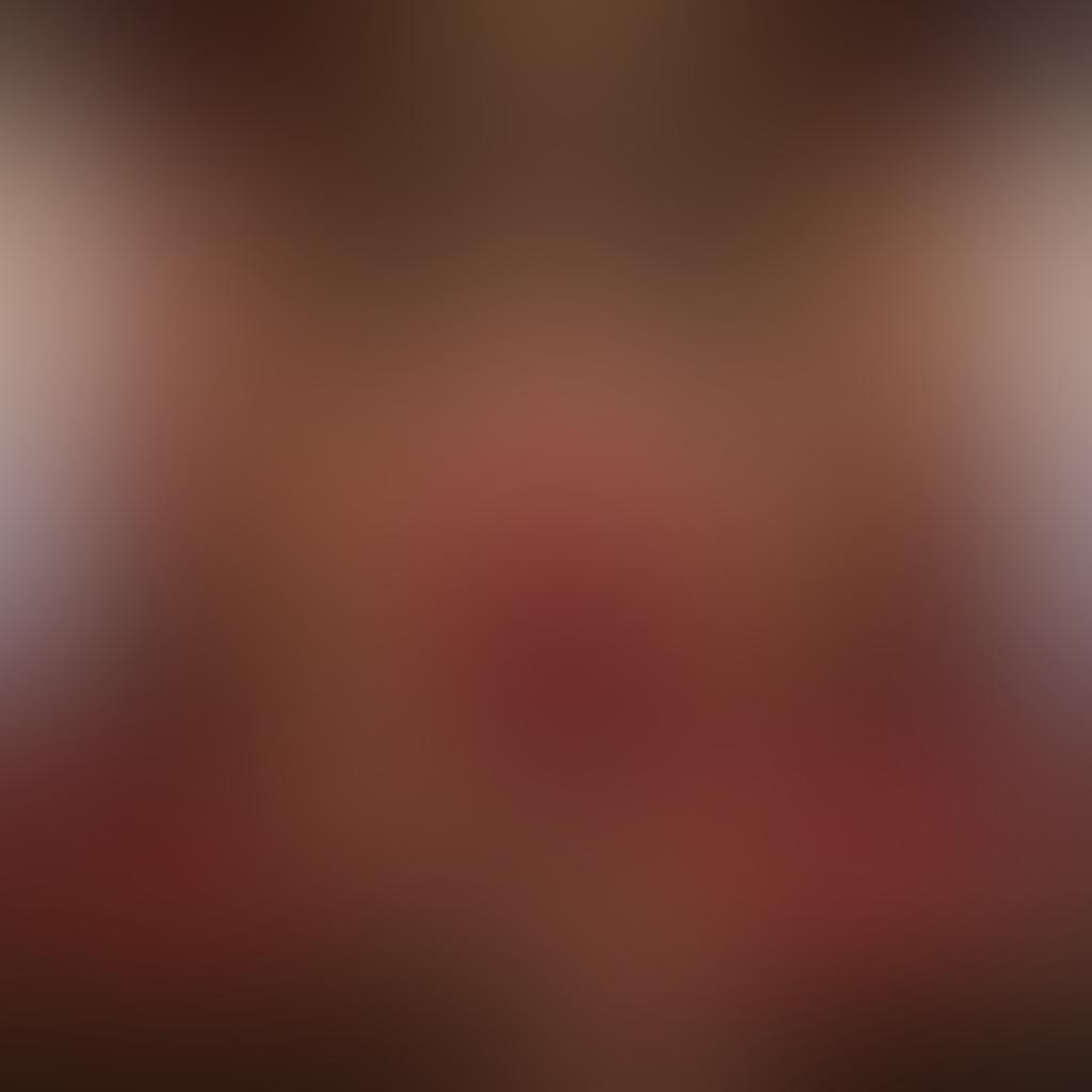 A powerful and confident woman standing tall in a beautifully adorned room filled with elements of kink culture, such as silk ropes and intricate bondage gear. The background should feature soft, warm lighting that highlights her empowerment and self-assuredness. Surround her with symbols of intimacy like wine glasses and plush cushions, emphasizing a connection to intimate relationships. Suggest a blend of elegance and strength in her expression, showcasing the harmony between femininity and empowerment. vibrant colors. super-realistic.